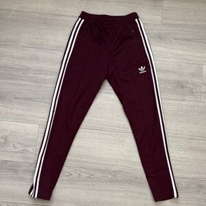 Adidas men’s Burgundy Joggers with White Stripes